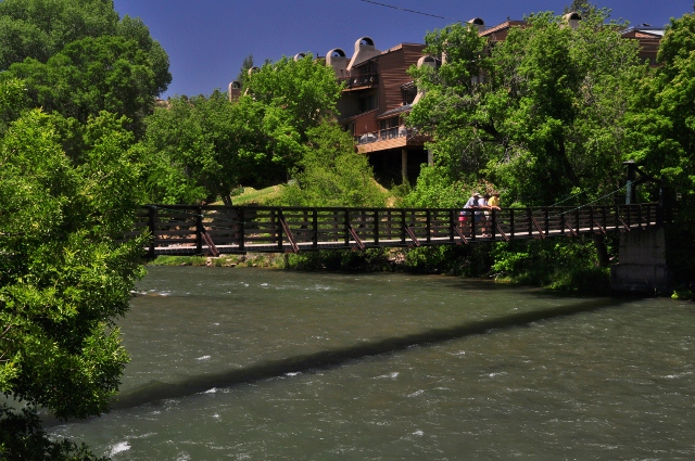 Along the riverwalk of the Animas River, a suspension bridge